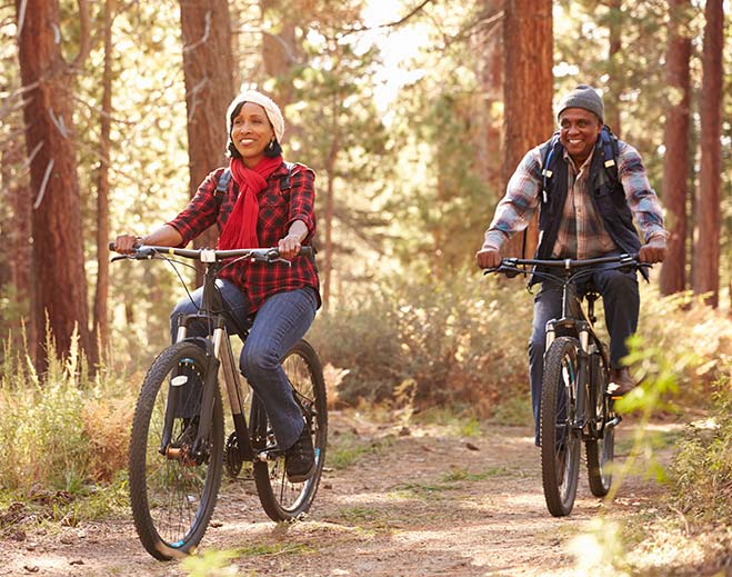 couple biking on trail